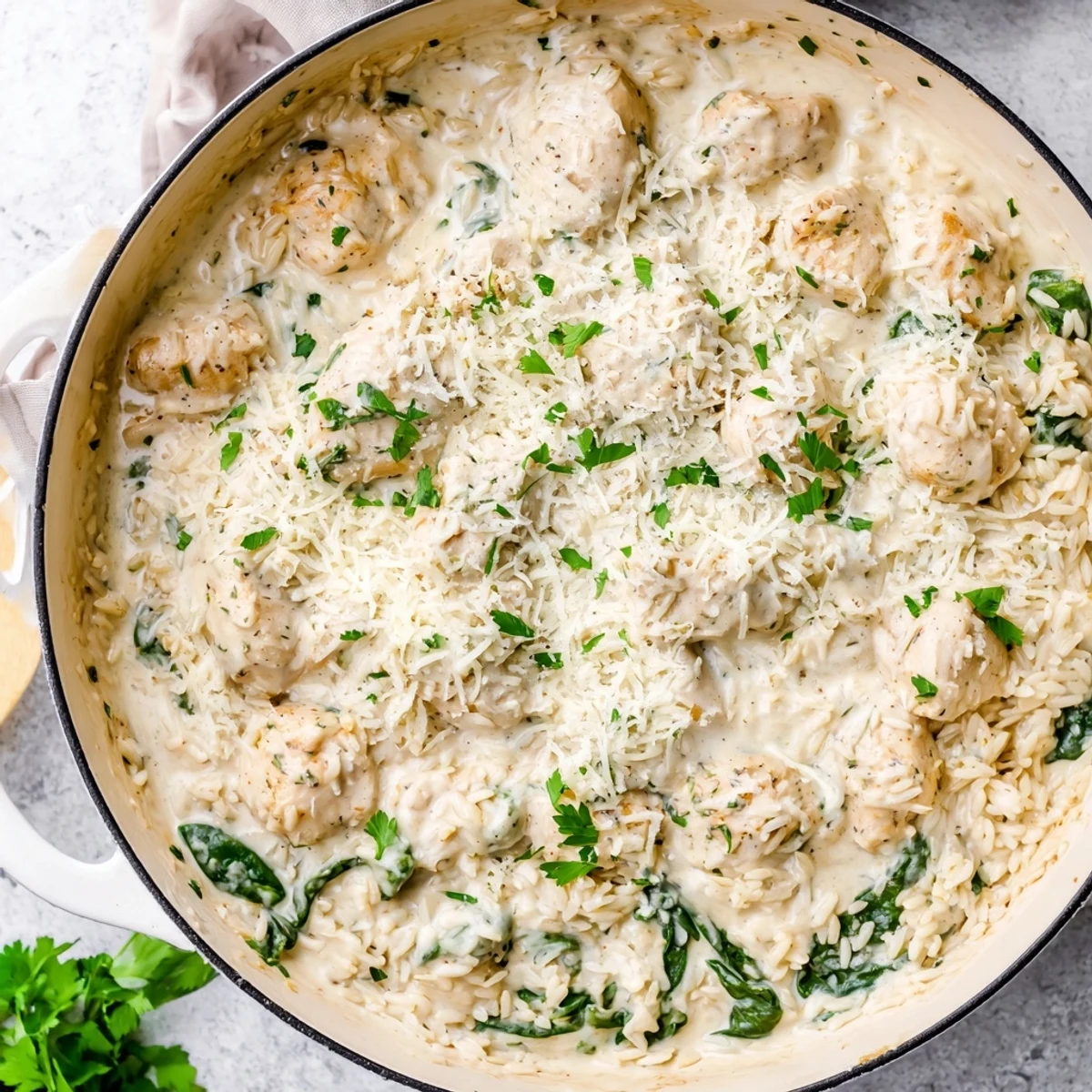Golden chicken breasts nestled over creamy Parmesan rice in this comforting one pot angel chicken dinner