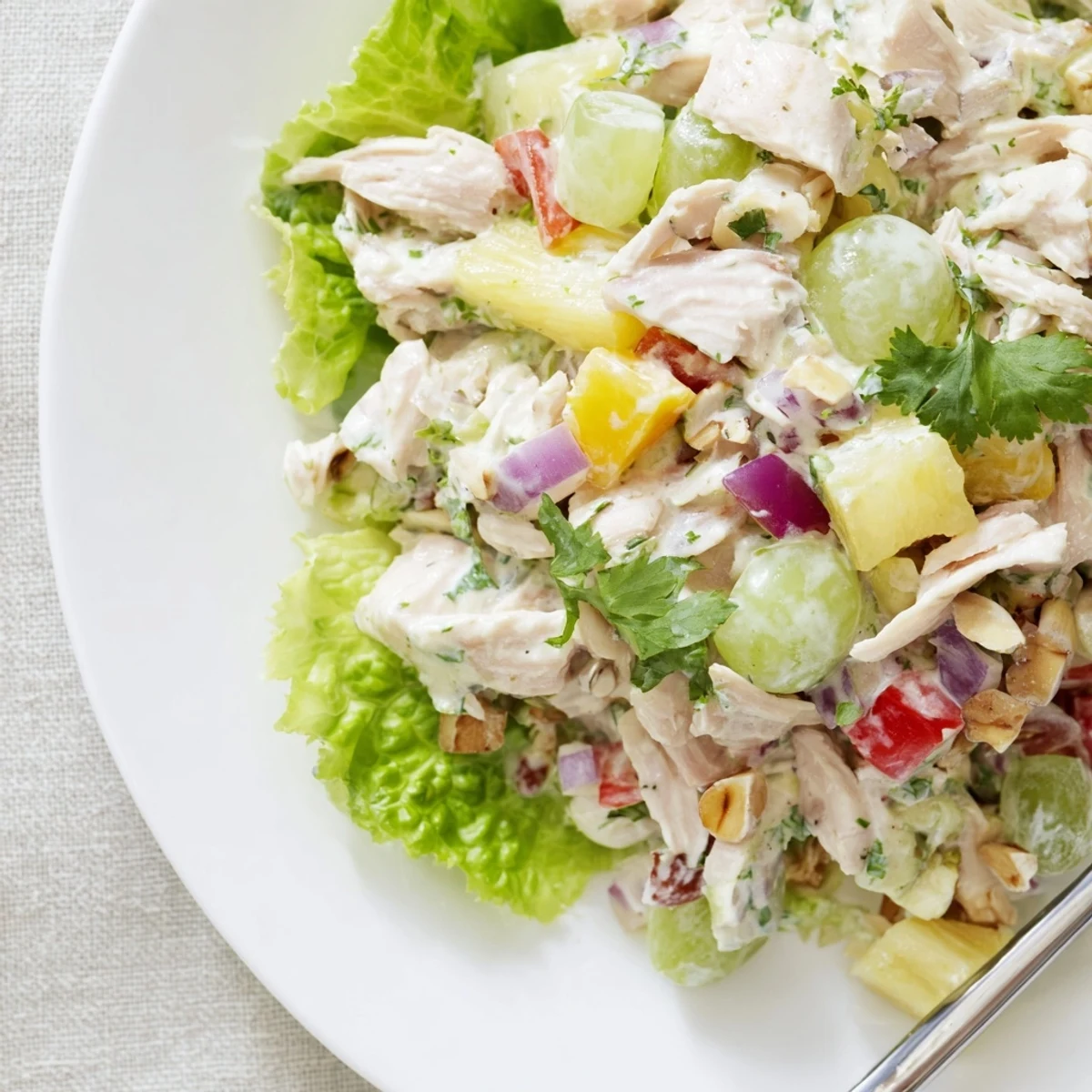 Chilled Hawaiian Chicken Salad Recipe tossed with crisp celery, grapes, toasted macadamias.