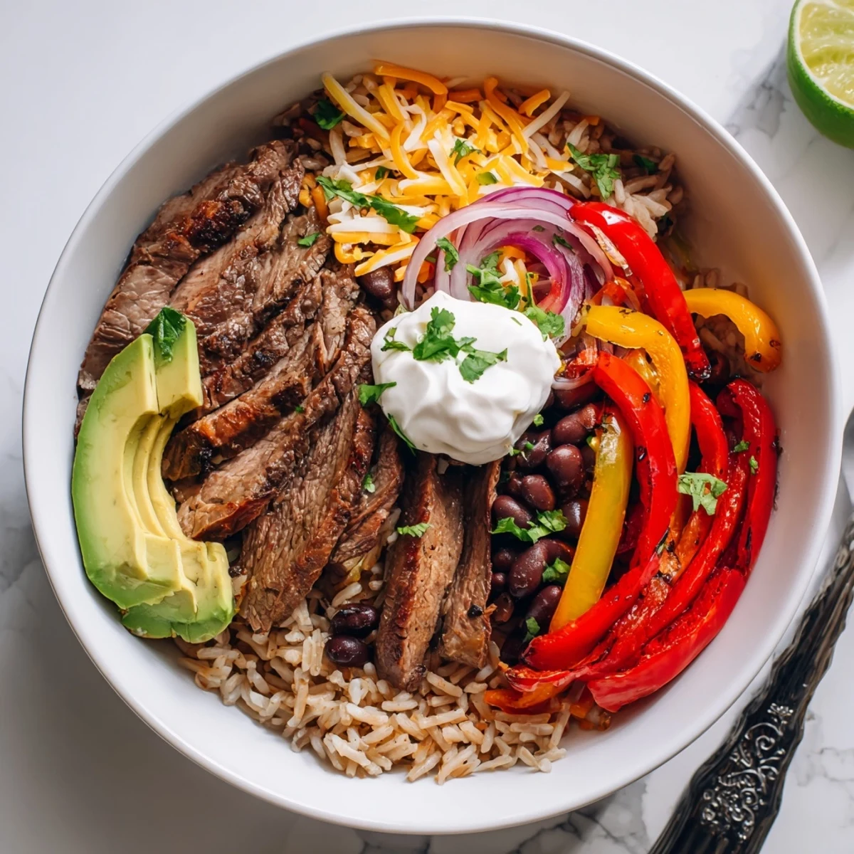 Steak Fajita Power Bowls with sizzling marinated steak, charred peppers and lime.